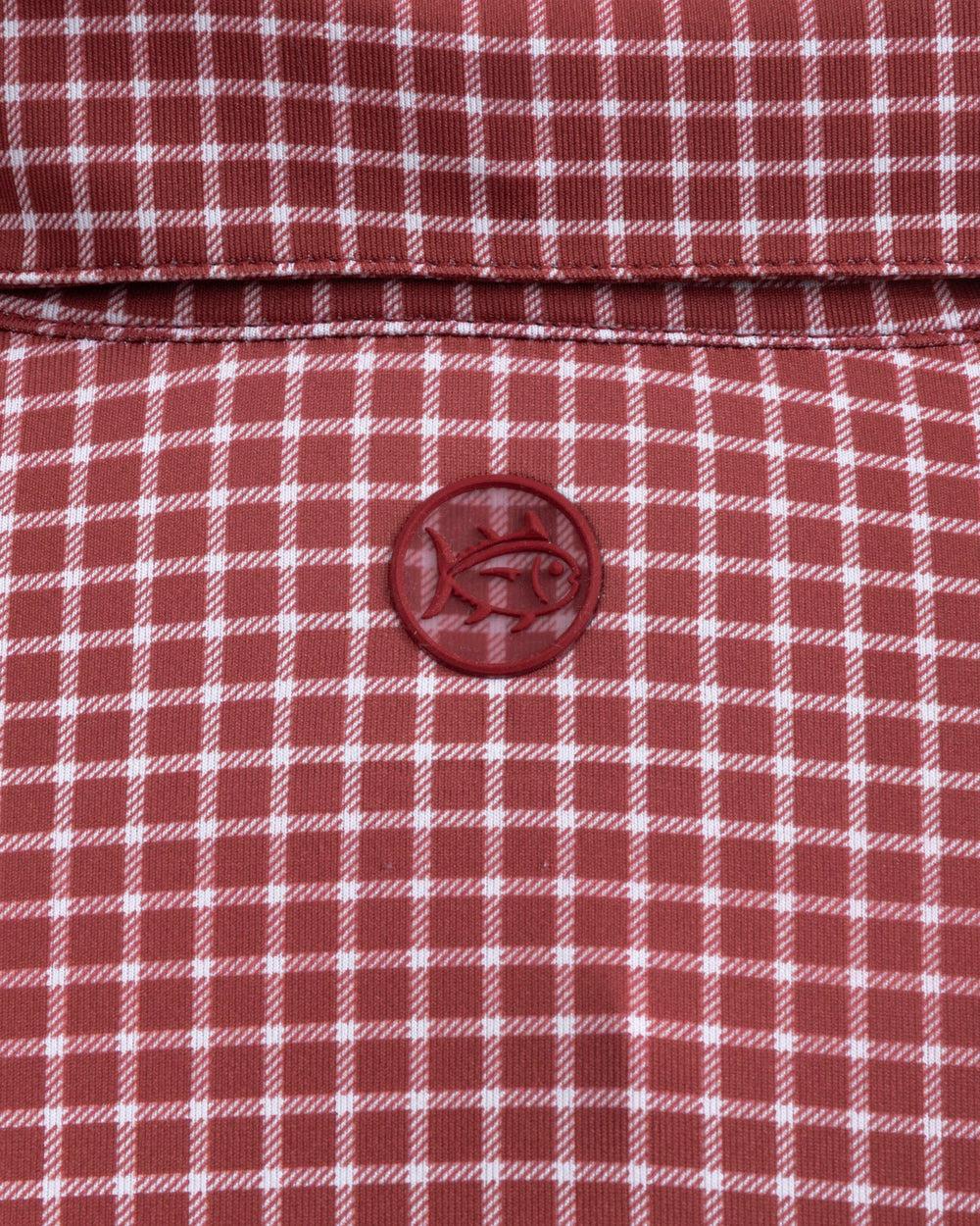 The detail view of the Southern Tide Driver Dunes Edge Team Colors Plaid Polo by Southern Tide - Crimson