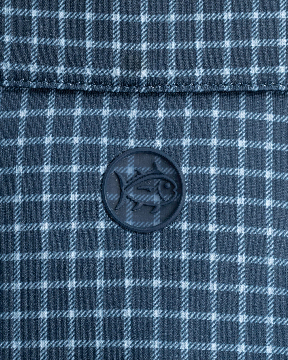 The detail view of the Southern Tide Driver Dunes Edge Team Colors Plaid Polo by Southern Tide - Navy