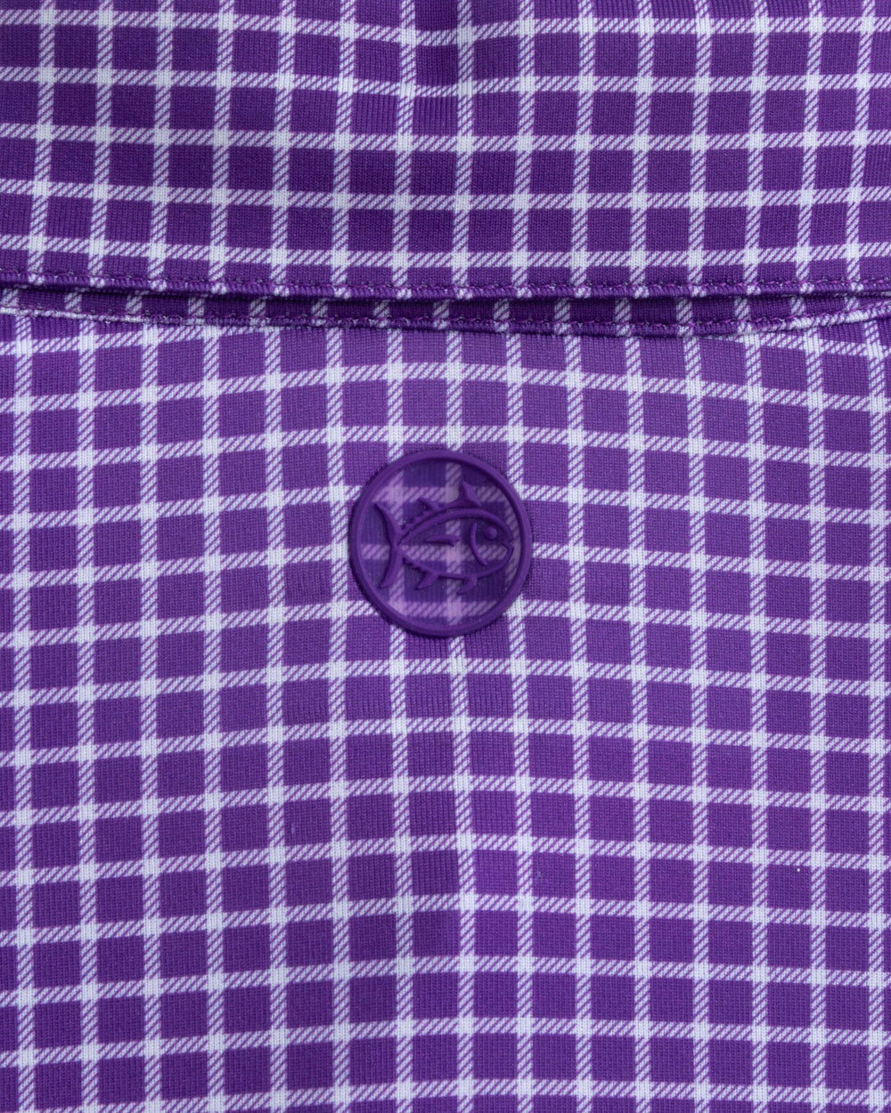 The detail view of the Southern Tide Driver Dunes Edge Team Colors Plaid Polo by Southern Tide - Regal Purple