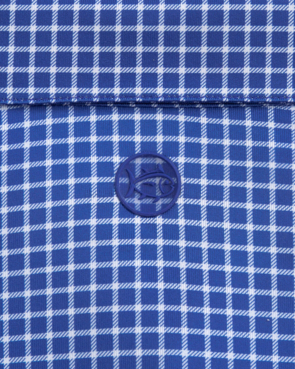 The detail view of the Southern Tide Driver Dunes Edge Team Colors Plaid Polo by Southern Tide - University Blue