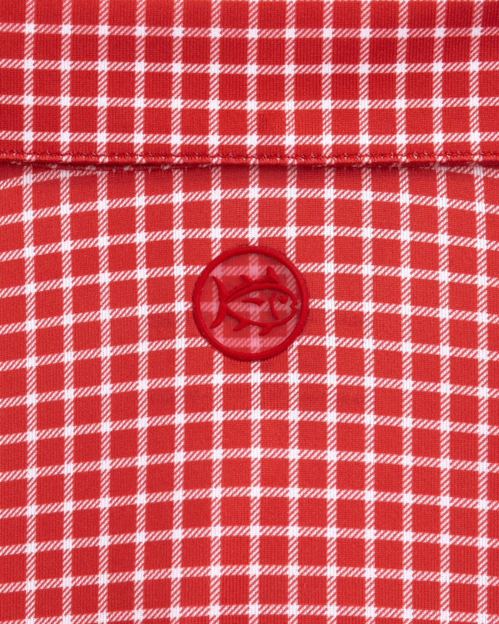 The detail view of the Southern Tide Driver Dunes Edge Team Colors Plaid Polo by Southern Tide - Varsity Red
