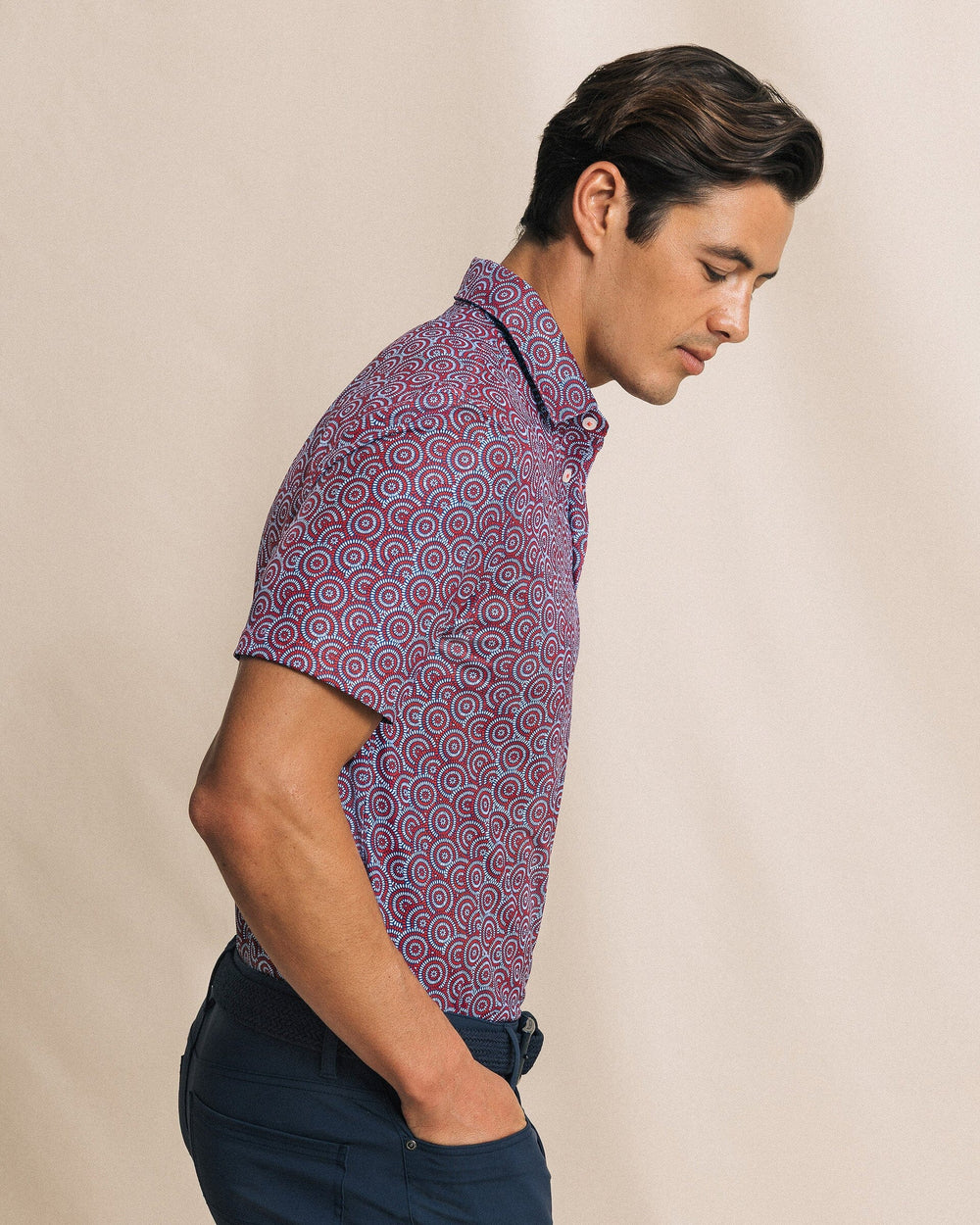 The side view of the Southern Tide Driver Fireworks Printed Polo by Southern Tide - Channel Marker Red