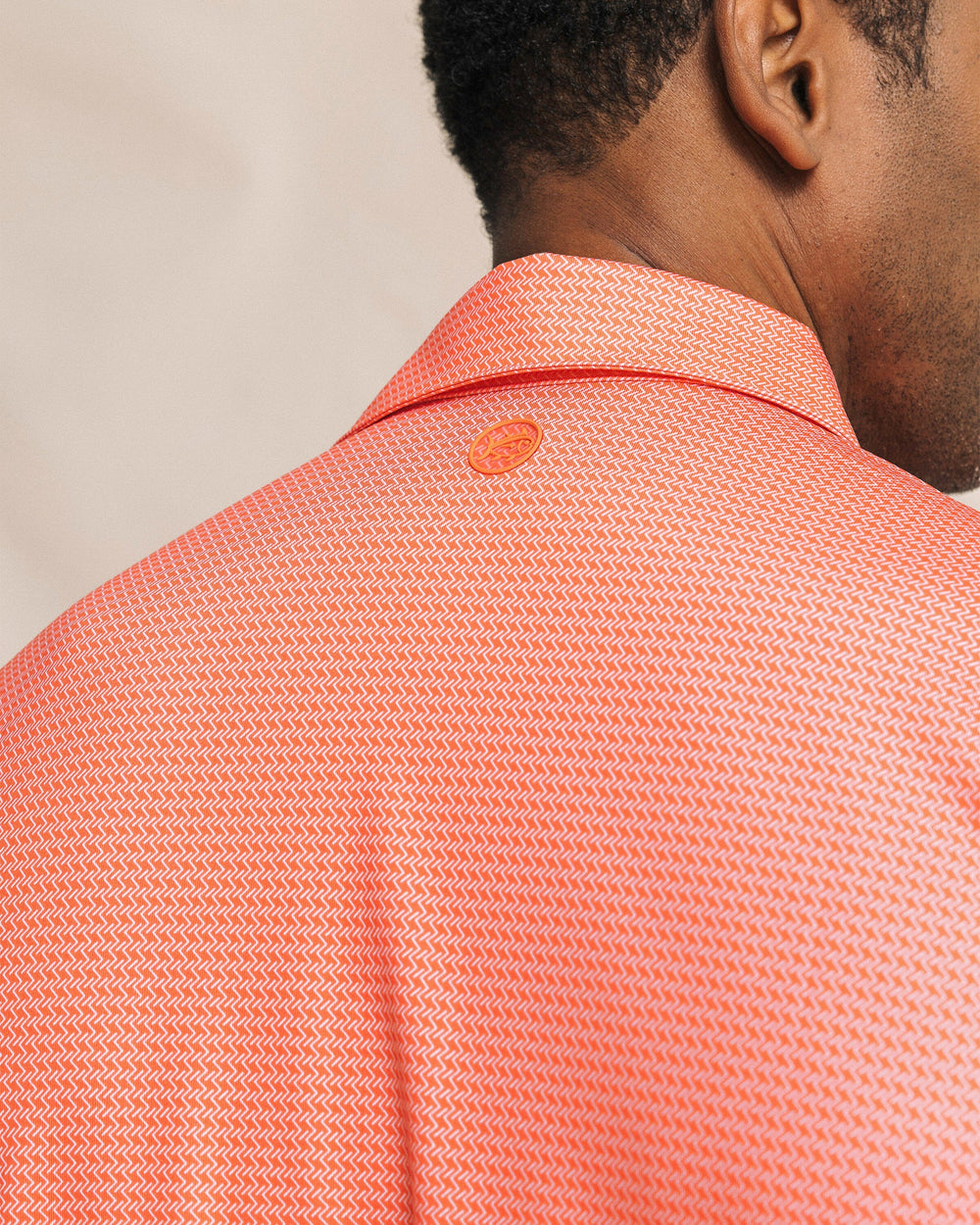 The detail view of the Southern Tide Driver Getting Ziggy With It Printed Polo by Southern Tide - Orange Blossom