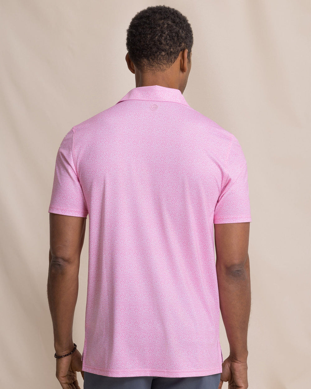 The back view of the Southern Tide Driver Paradise Shores Printed Polo by Southern Tide - Orchid Pink
