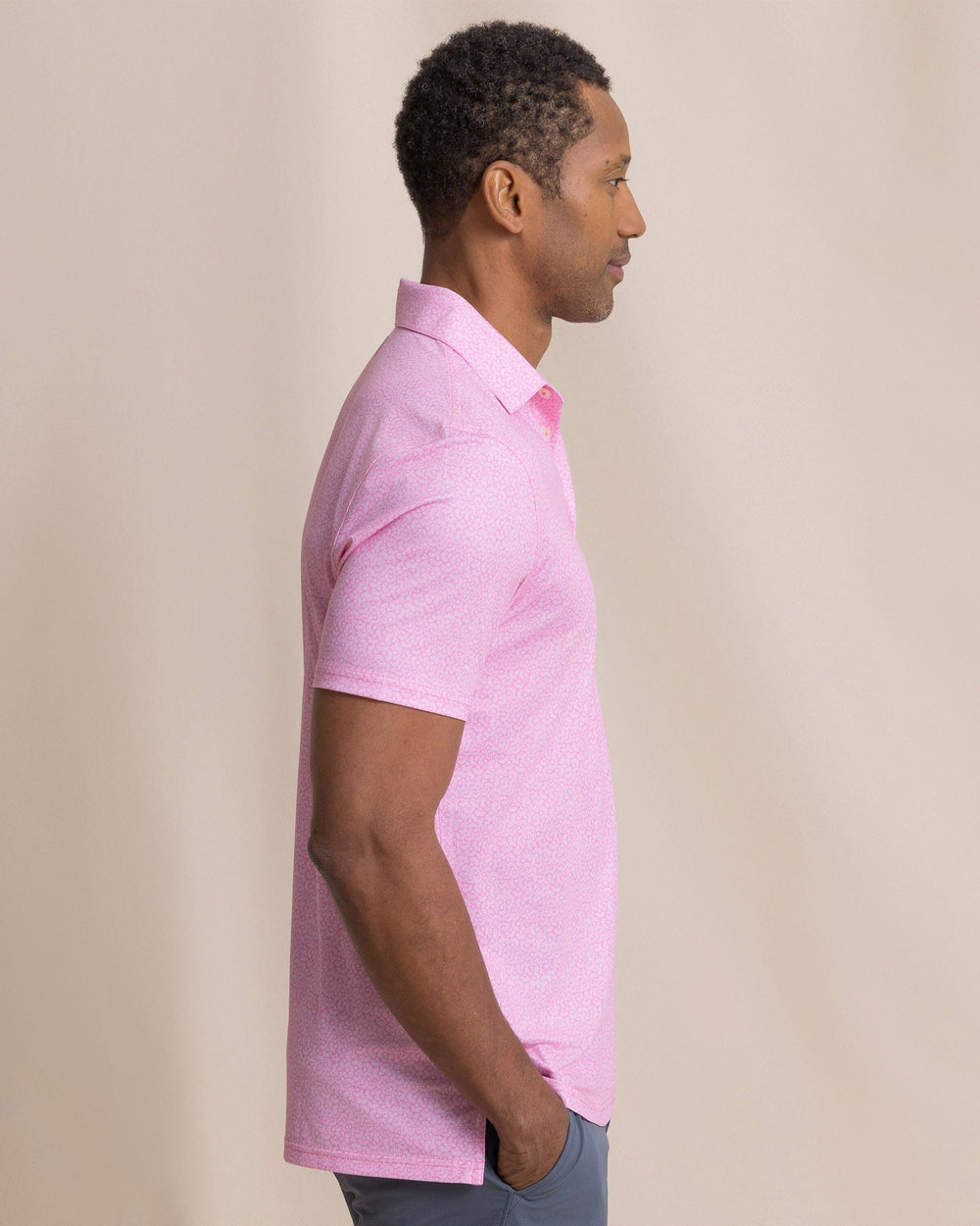 The side view of the Southern Tide Driver Paradise Shores Printed Polo by Southern Tide - Orchid Pink