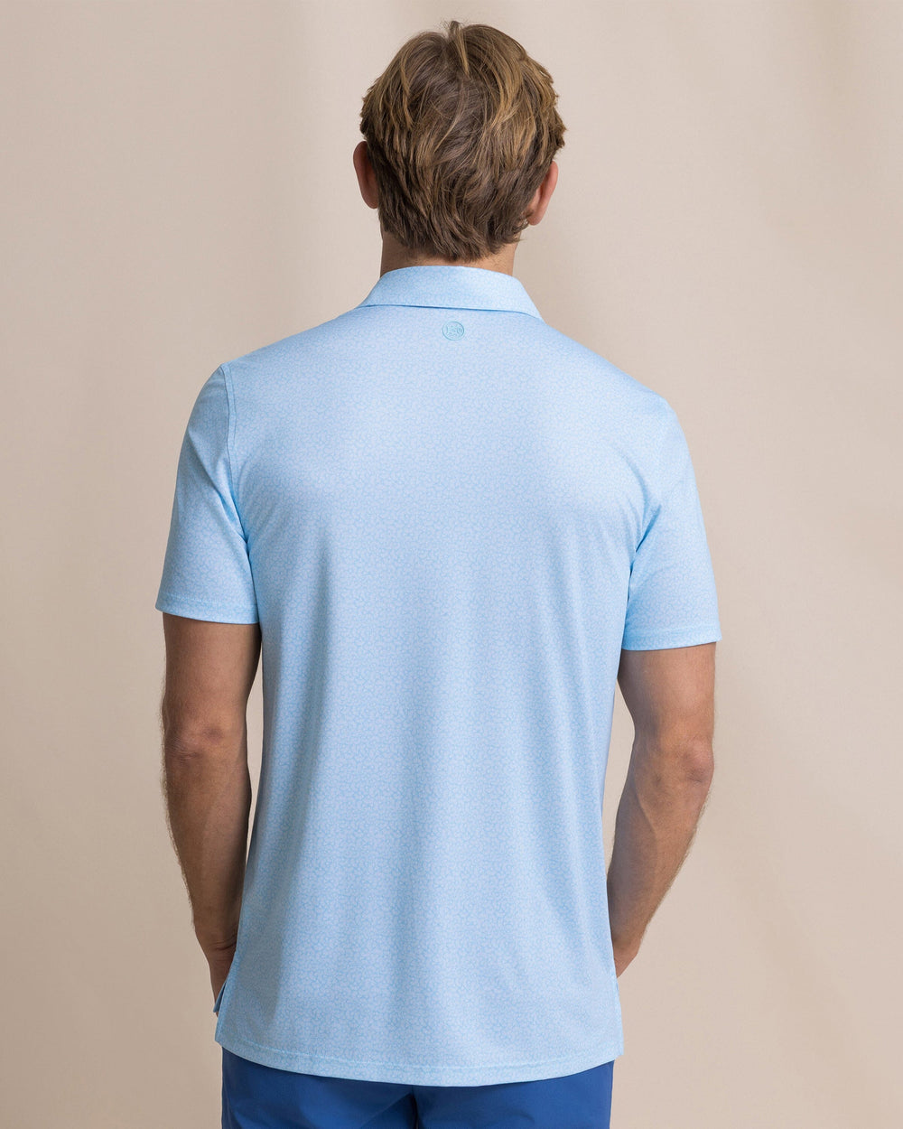 The back view of the Southern Tide Driver Paradise Shores Printed Polo by Southern Tide - Tropical Breeze Blue