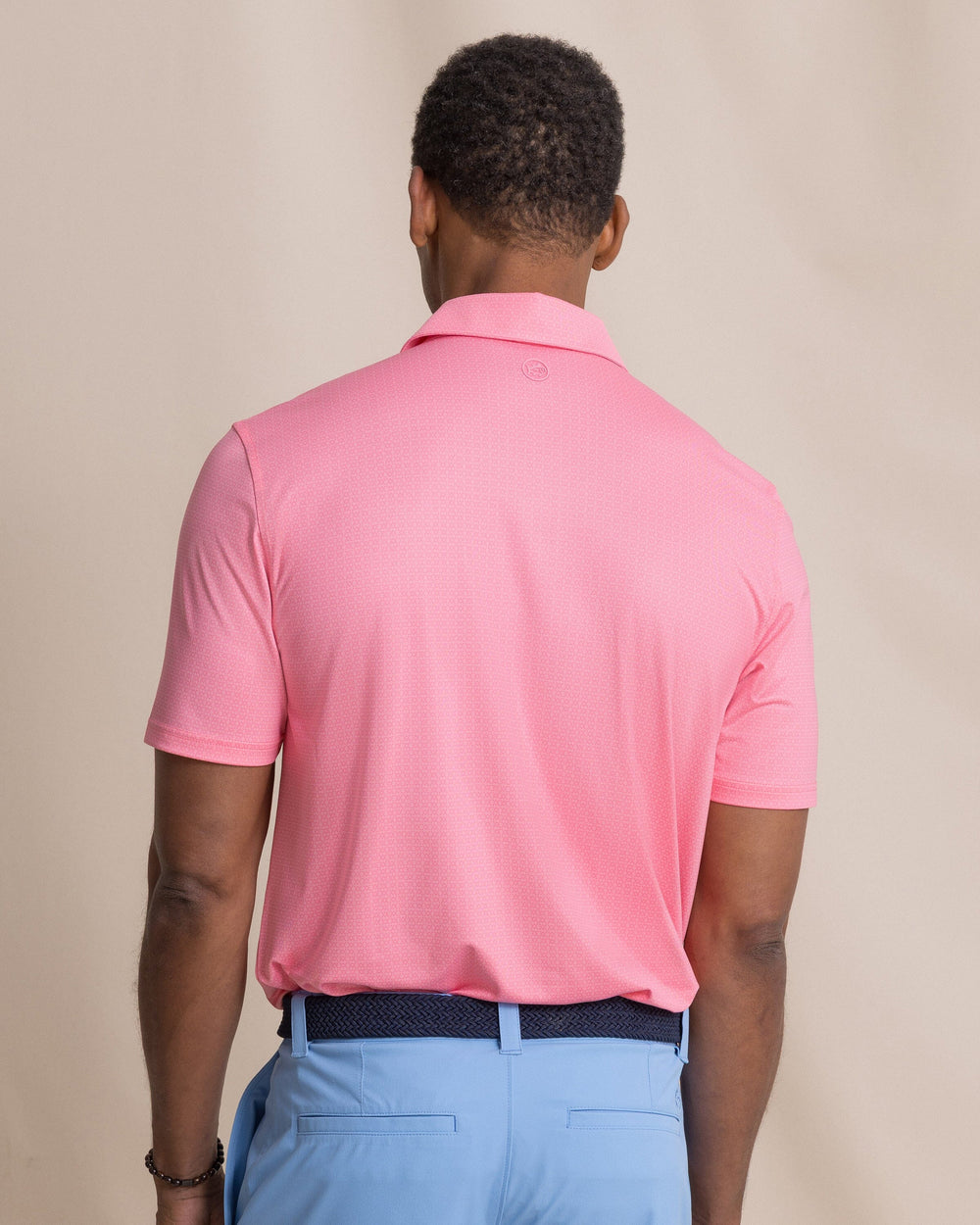 The back view of the Southern Tide Driver Seaside Geo Printed Polo by Southern Tide - Sea Pink