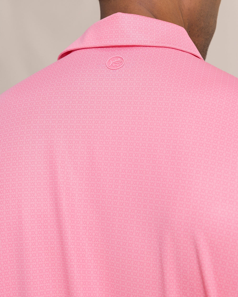 The detail view of the Southern Tide Driver Seaside Geo Printed Polo by Southern Tide - Sea Pink