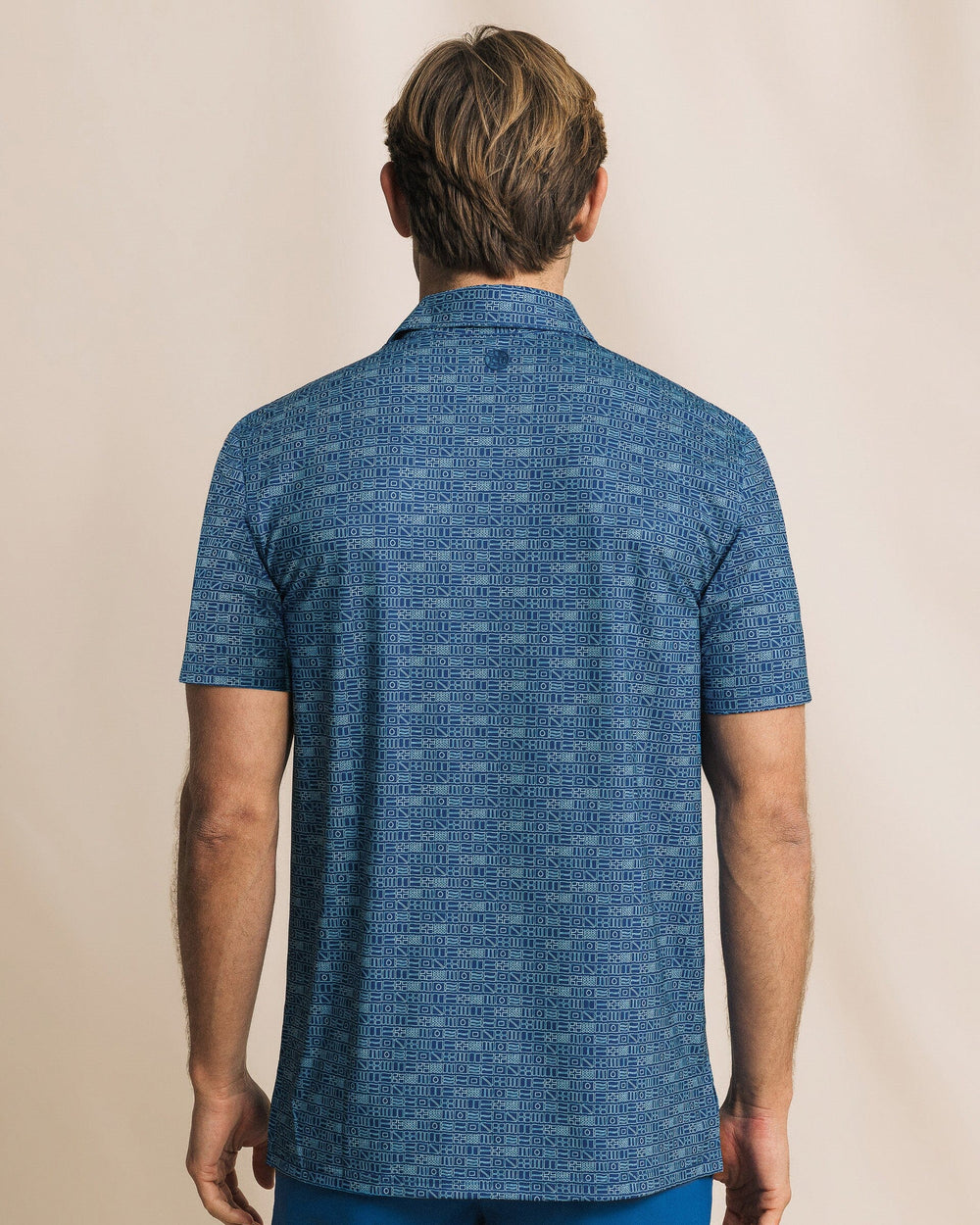 The back view of the Southern Tide Driver ST Nautical Flag Printed Polo by Southern Tide - Nautical Blue