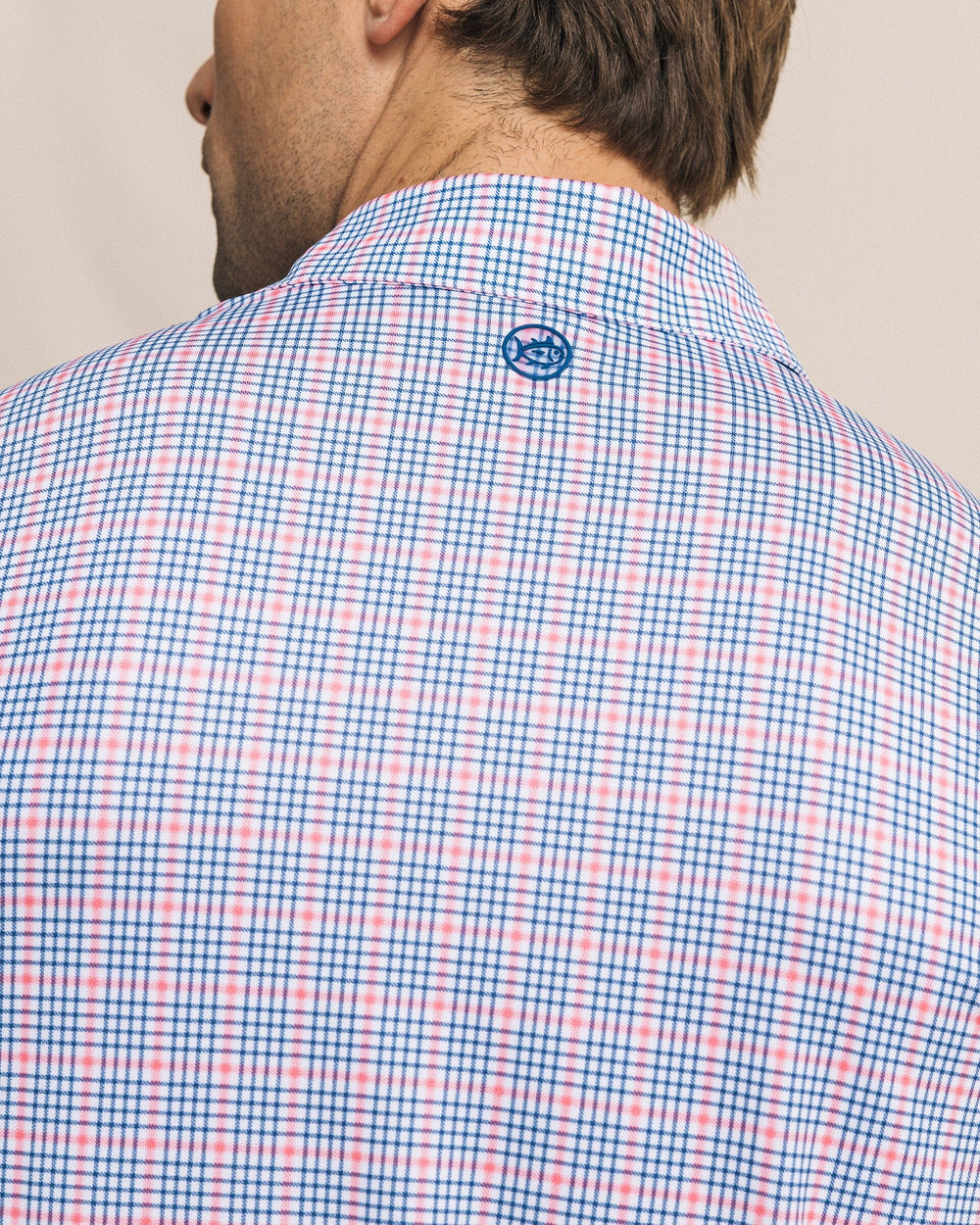 The detail view of the Southern Tide Driver Surfside Retreat Plaid Polo by Southern Tide - Island Pink