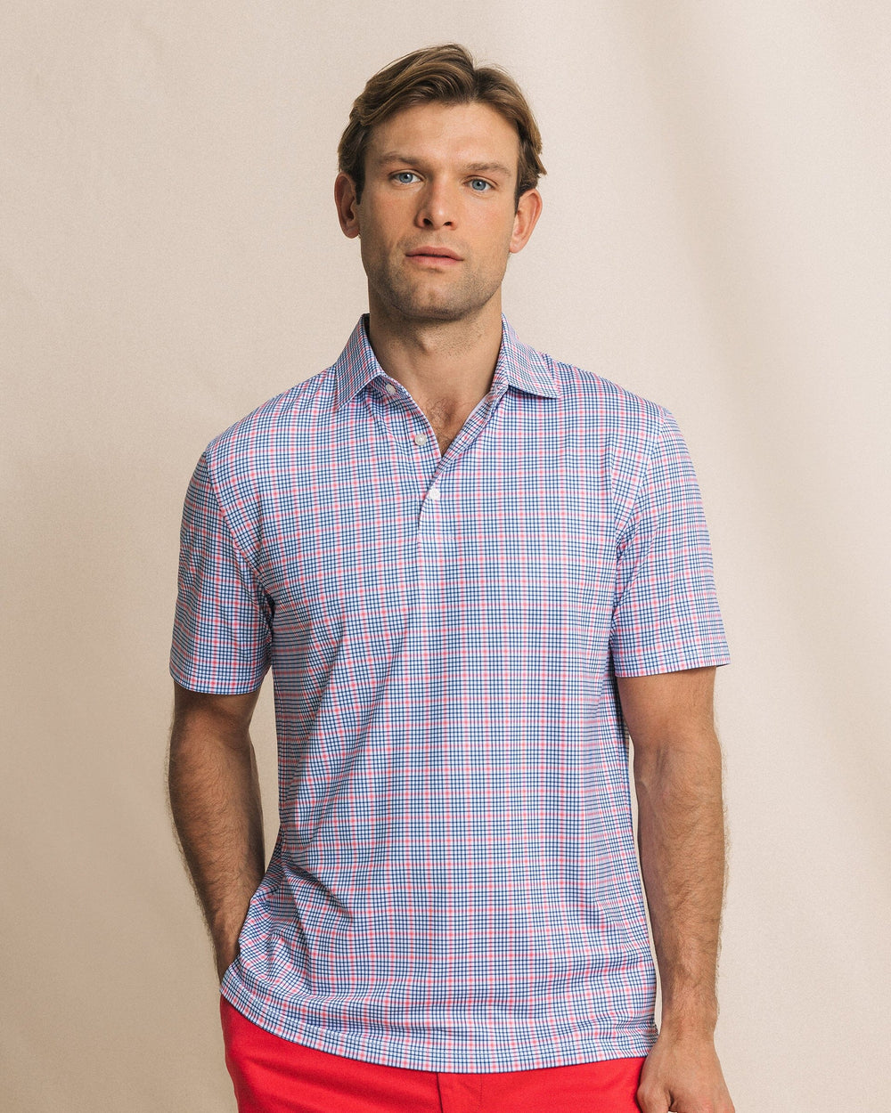The front view of the Southern Tide Driver Surfside Retreat Plaid Polo by Southern Tide - Island Pink