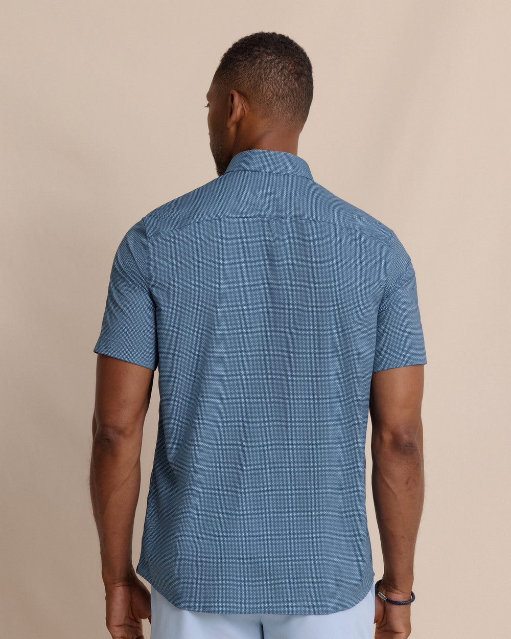 The back view of the Southern Tide Eastport Heather brrr°® Intercoastal Short Sleeve Sport Shirt by Southern Tide - Dress Blue