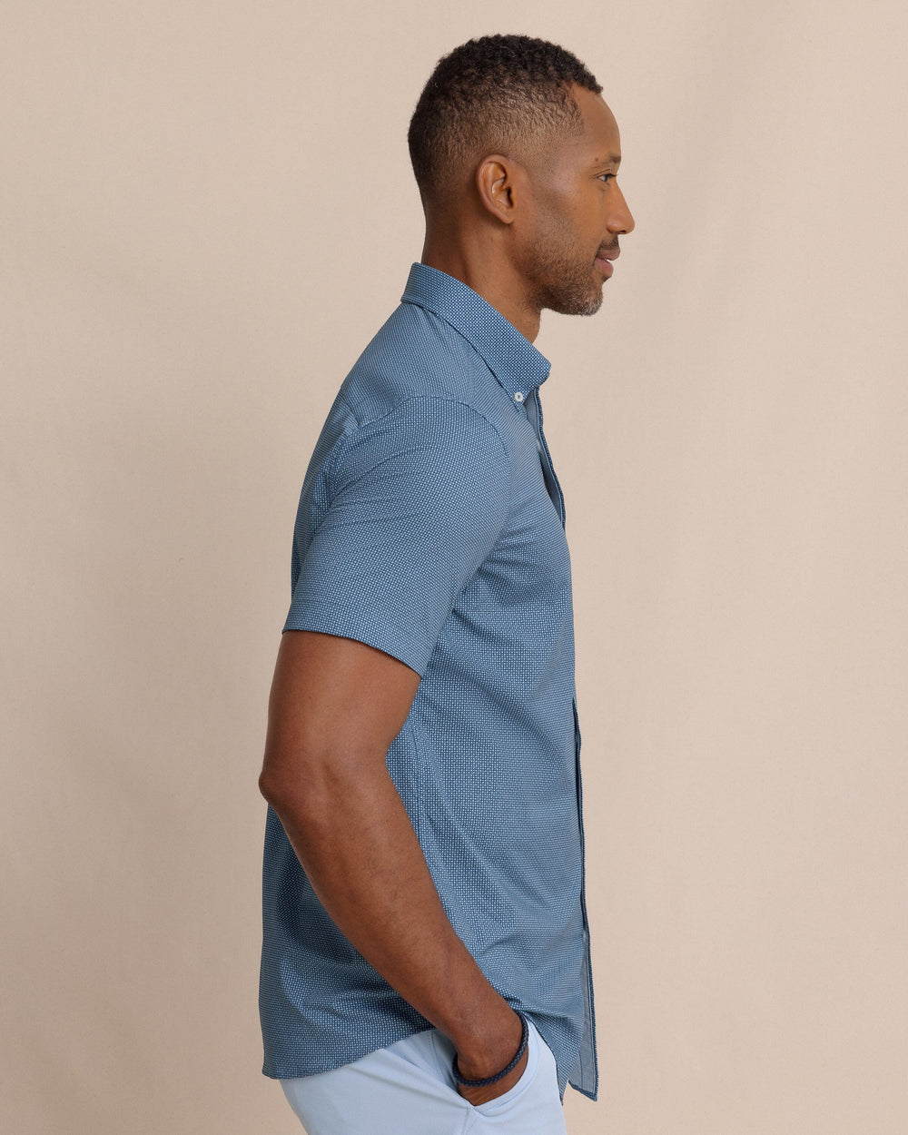 The side view of the Southern Tide Eastport Heather brrr°® Intercoastal Short Sleeve Sport Shirt by Southern Tide - Dress Blue