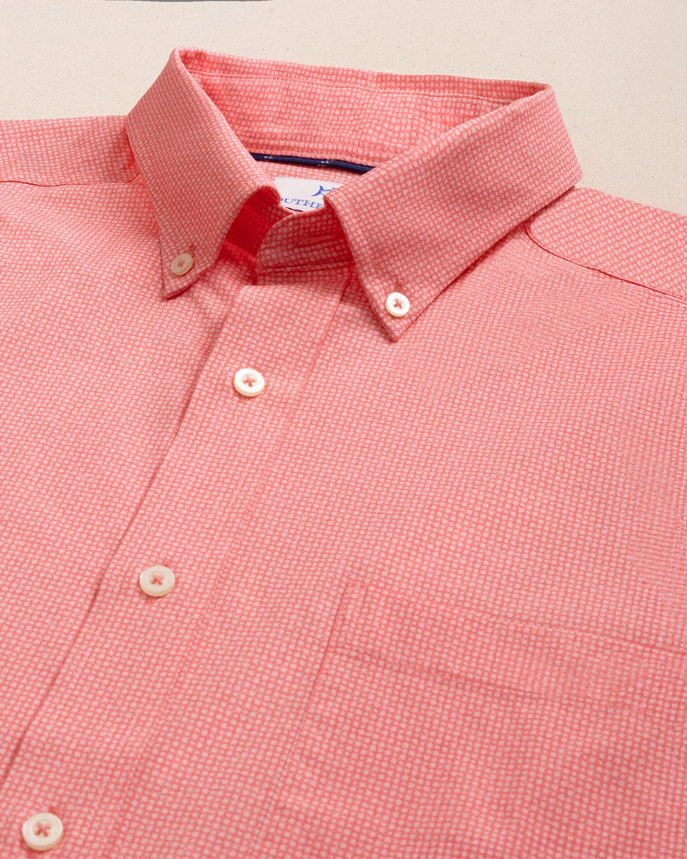 The detail view of the Southern Tide Eastport Heather brrr°® Intercoastal Short Sleeve Sport Shirt by Southern Tide - Sunkist Coral