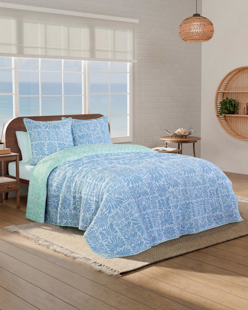 The side view of the Southern Tide Eldora Reversible Quilt by Southern Tide - Blue