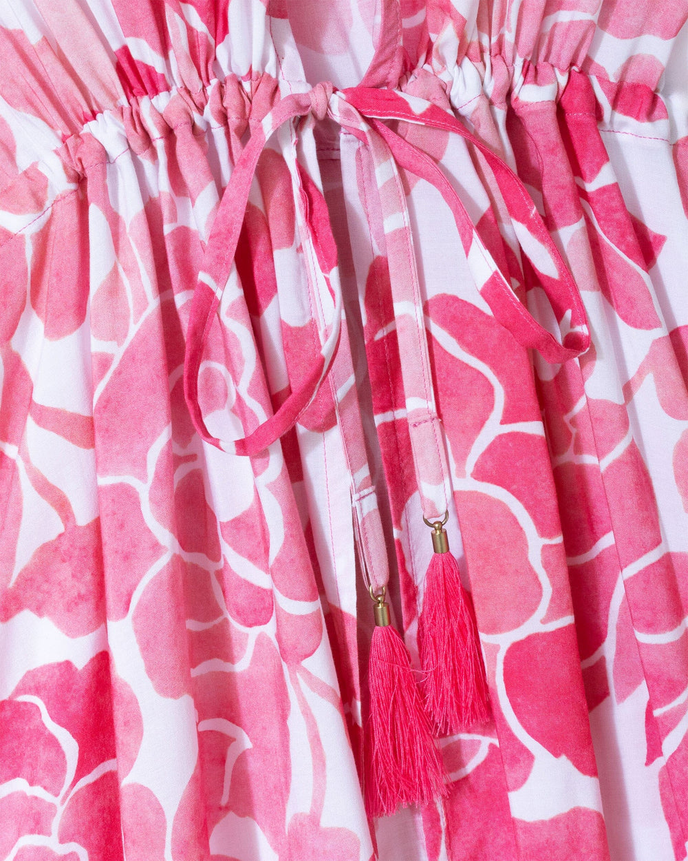 The detail view of the Southern Tide Floral Bell Sleeve Short Tunic Cover-Up by Southern Tide - Island Pink