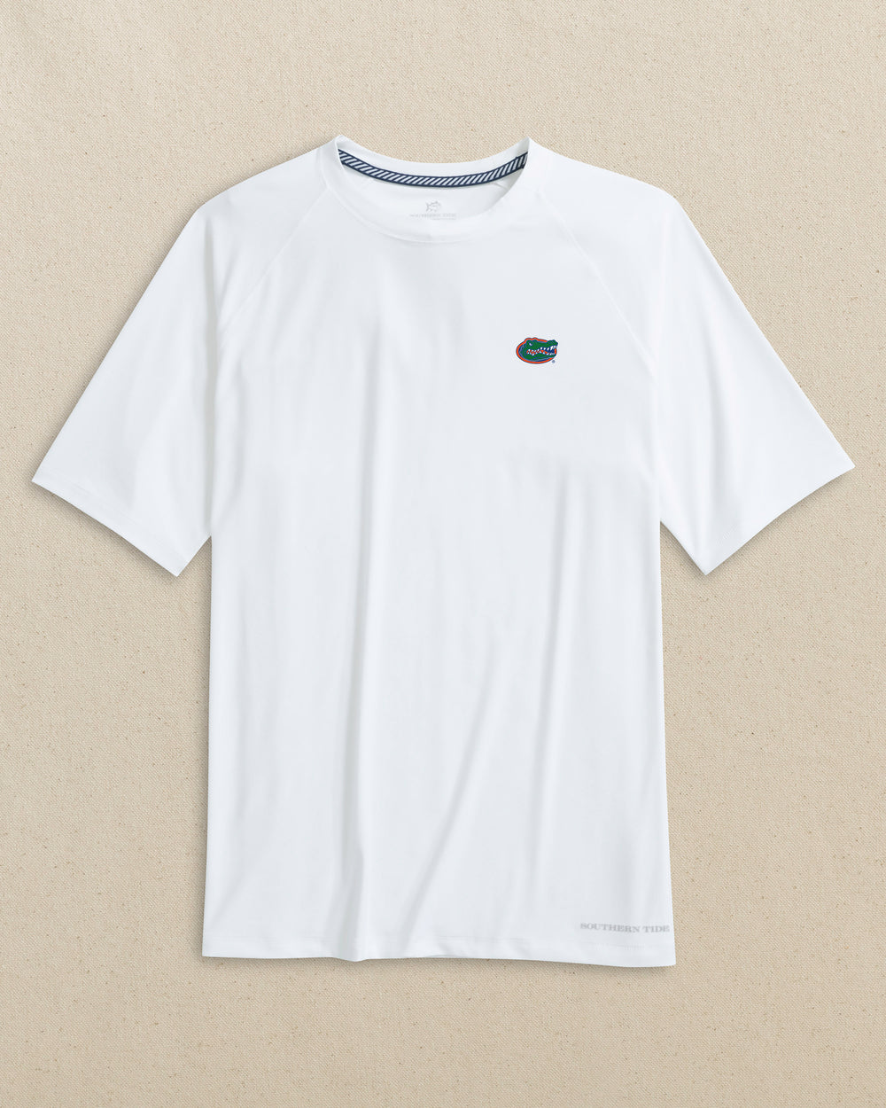 The front view of the Southern Tide Florida Gators brrr°®-illiant Performance T-Shirt by Southern Tide - Classic White