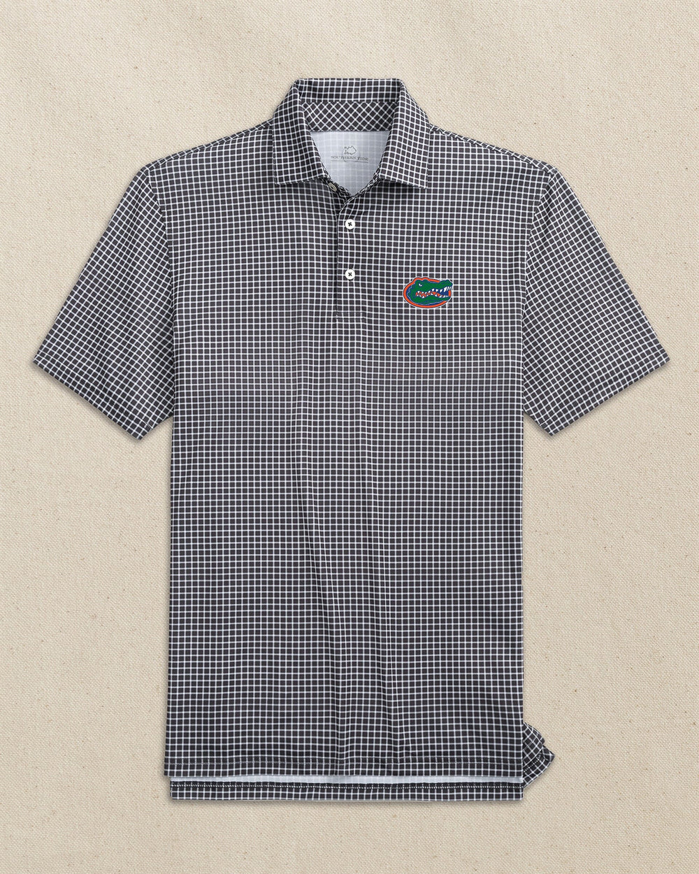 The front view of the Southern Tide Florida Gators Driver Dunes Edge Plaid Polo by Southern Tide - Black
