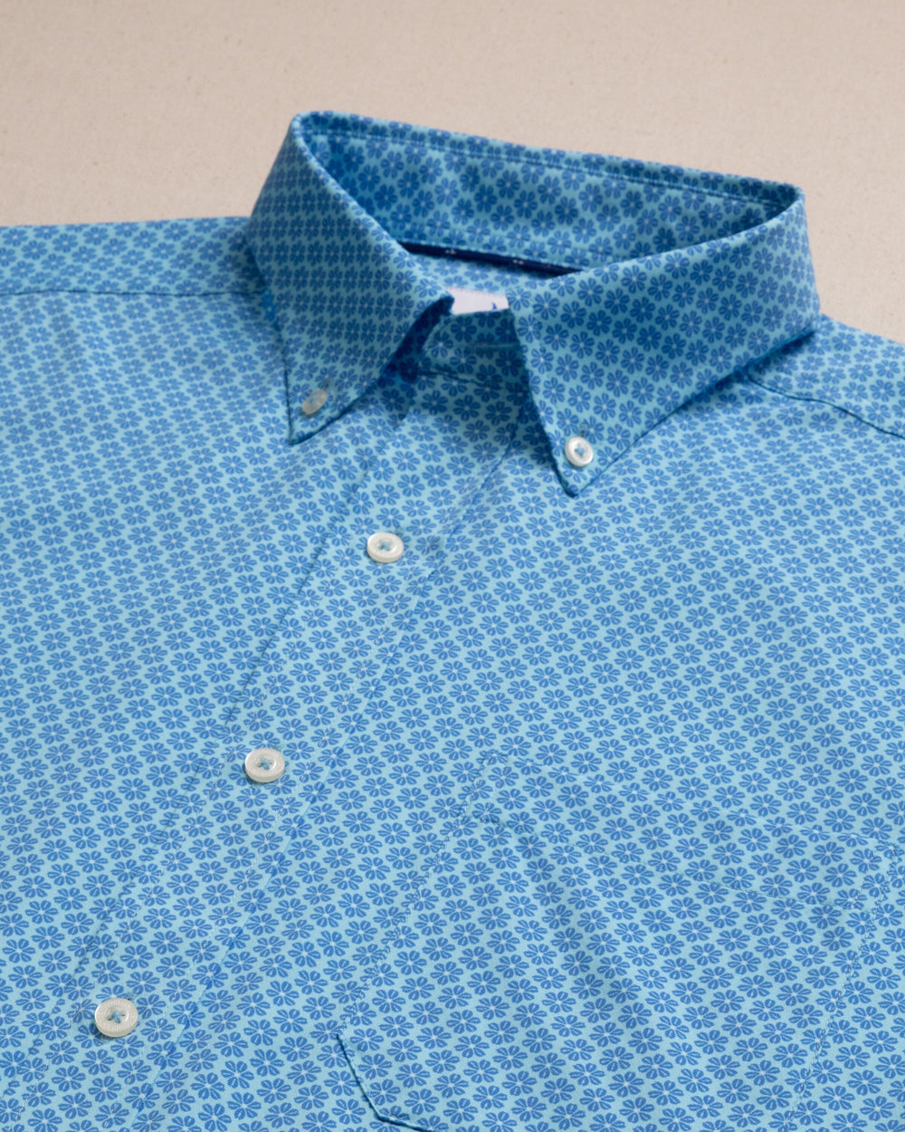 The detail view of the Southern Tide Flower Garden Coastal Breeze® Short Sleeve Sport Shirt by Southern Tide - Tropical Breeze Blue