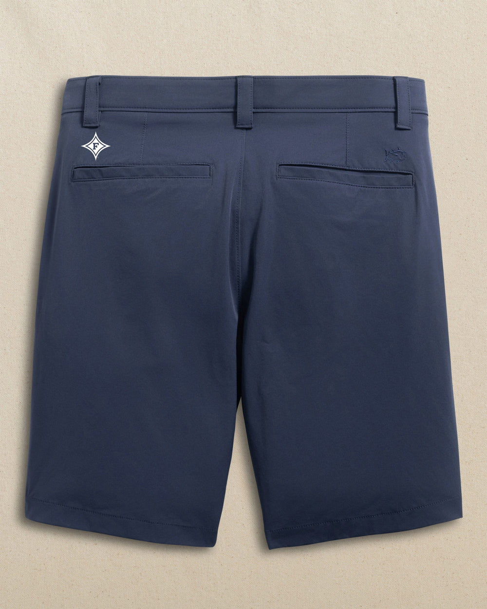The back view of the Southern Tide Furman Paladins Birdie 8" Coastal Breeze® Performance Short by Southern Tide - True Navy