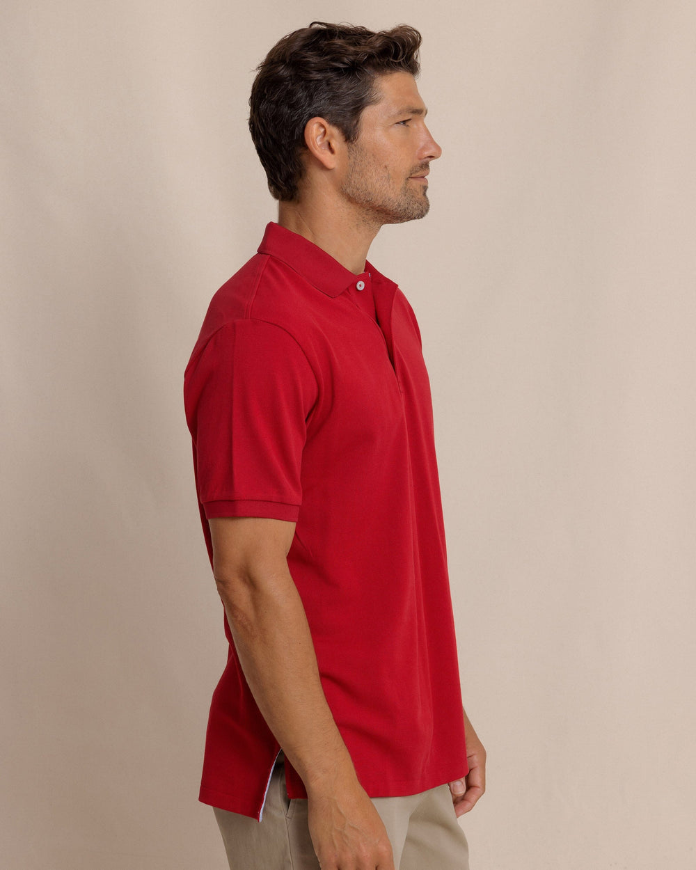 The side view of the Southern Tide Skipjack Gameday Colors Polo Shirt by Southern Tide - Crimson