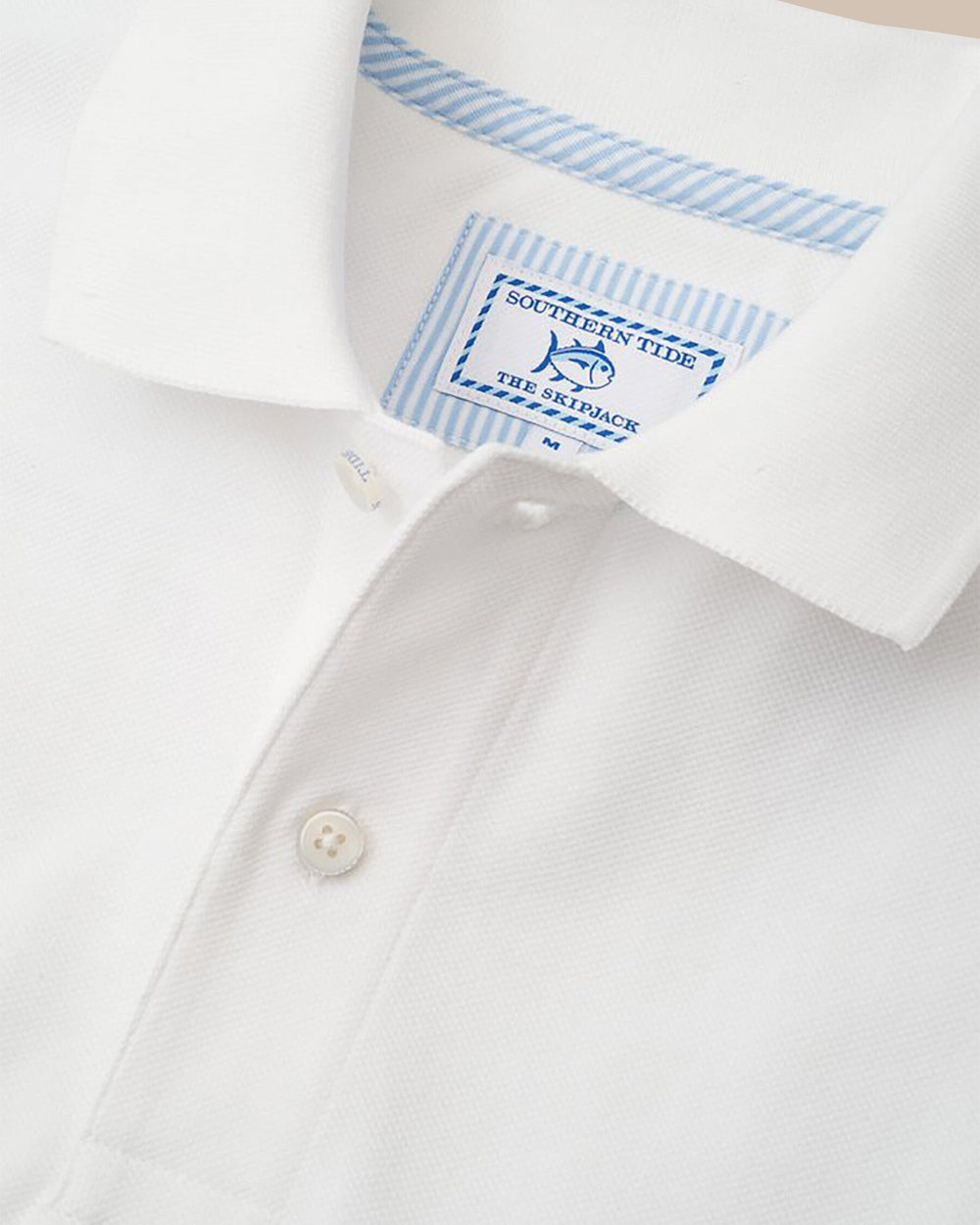 The detail view of the Men's White Florida Gators Pique Polo Shirt by Southern Tide - Classic White
