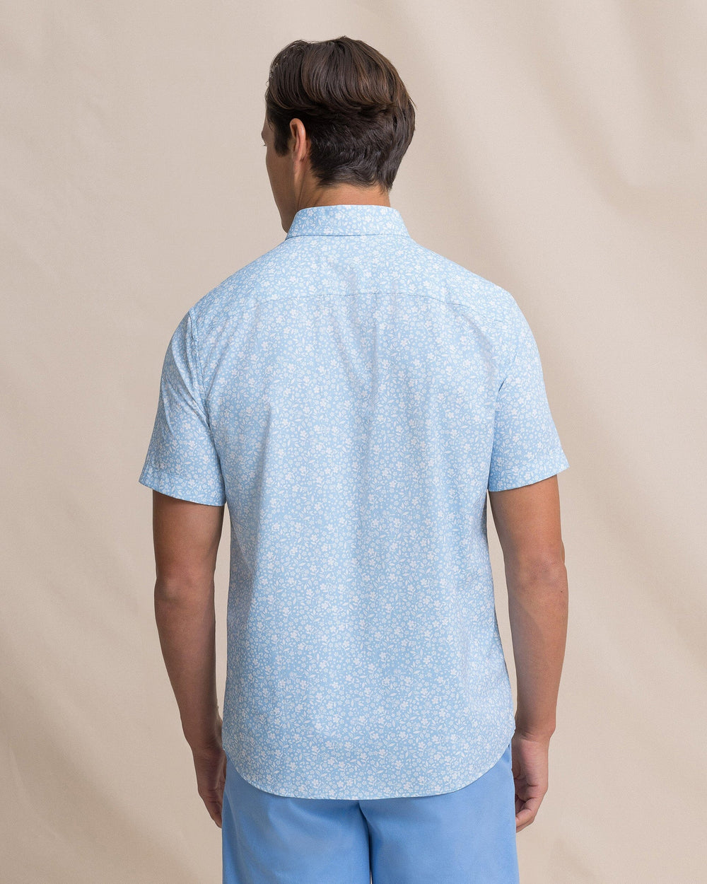 The back view of the Southern Tide Garden Blooms Coastal Breeze® Short Sleeve Sport Shirt by Southern Tide - Tide Blue