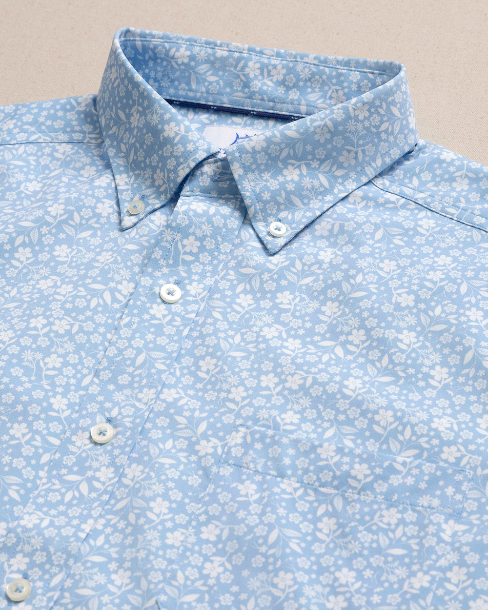 The detail view of the Southern Tide Garden Blooms Coastal Breeze® Short Sleeve Sport Shirt by Southern Tide - Tide Blue