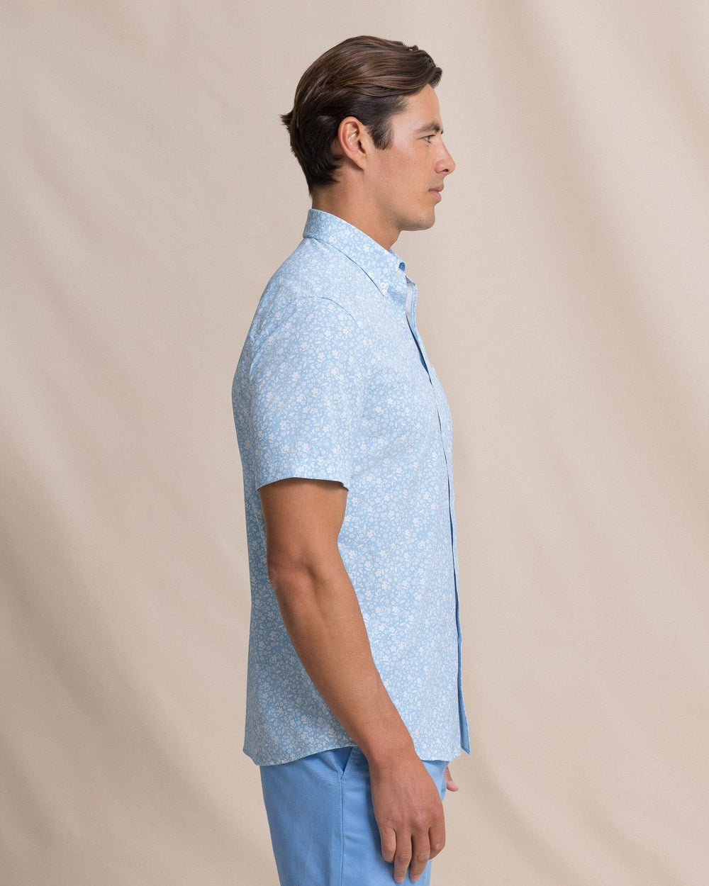 The side view of the Southern Tide Garden Blooms Coastal Breeze® Short Sleeve Sport Shirt by Southern Tide - Tide Blue