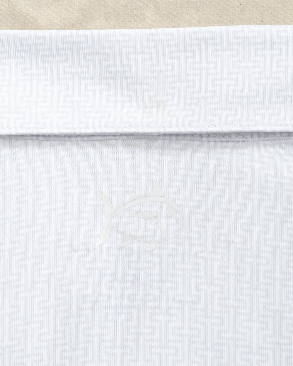 The detail view of the Southern Tide Georgia Bulldogs Driver ST Geo Printed Polo by Southern Tide - Classic White