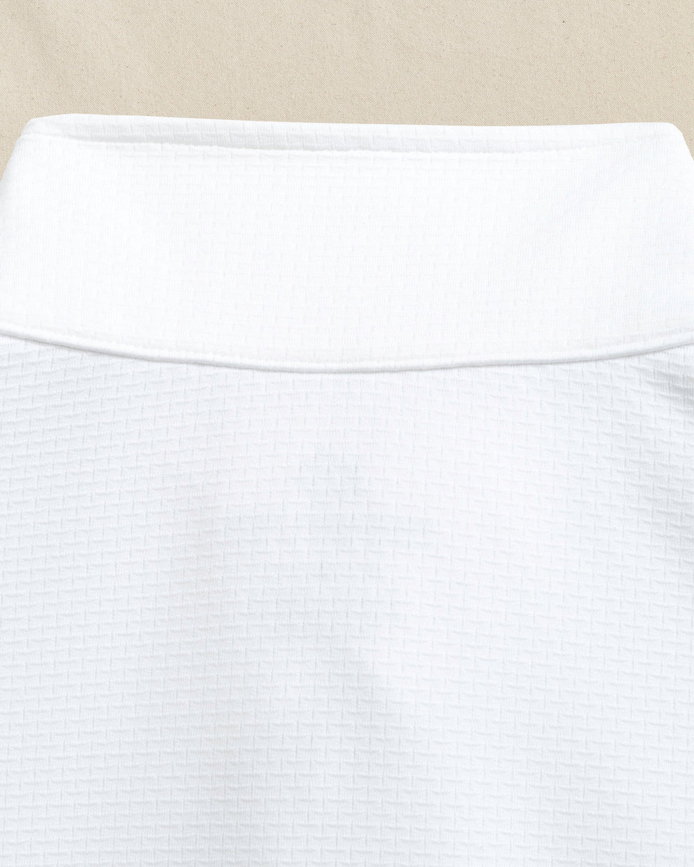 The detail view of the Southern Tide Georgia Bulldogs Oval G Schooner Quarter Zip by Southern Tide - Classic White