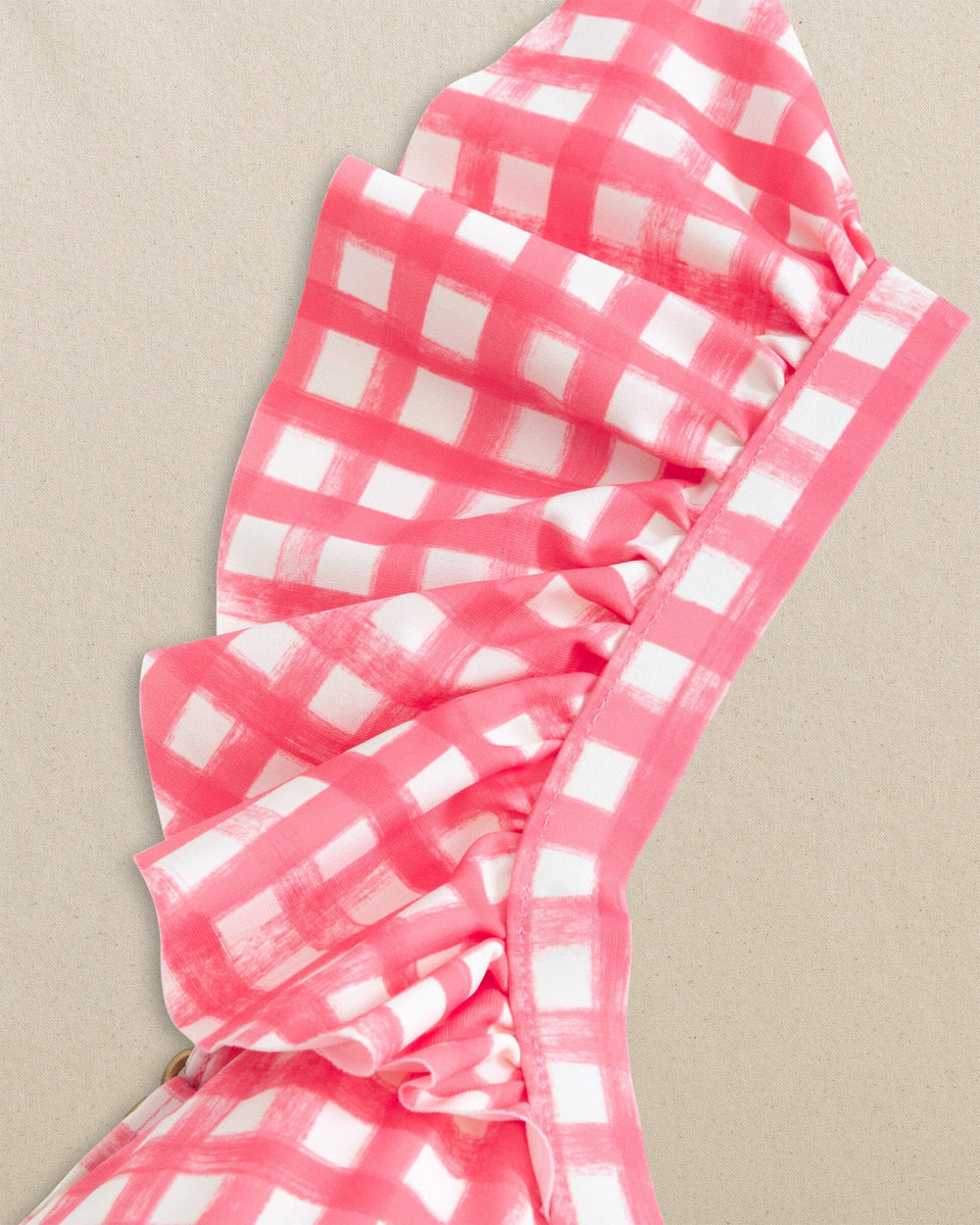 The detail view of the Southern Tide Gingham Banded Ruffle Bikini Top by Southern Tide - Island Pink