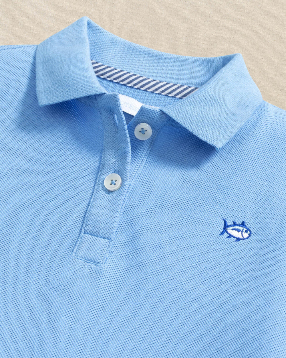 The detail view of the Southern Tide Girls Skipjack Dropwaist Polo Dress by Southern Tide - Ocean Channel