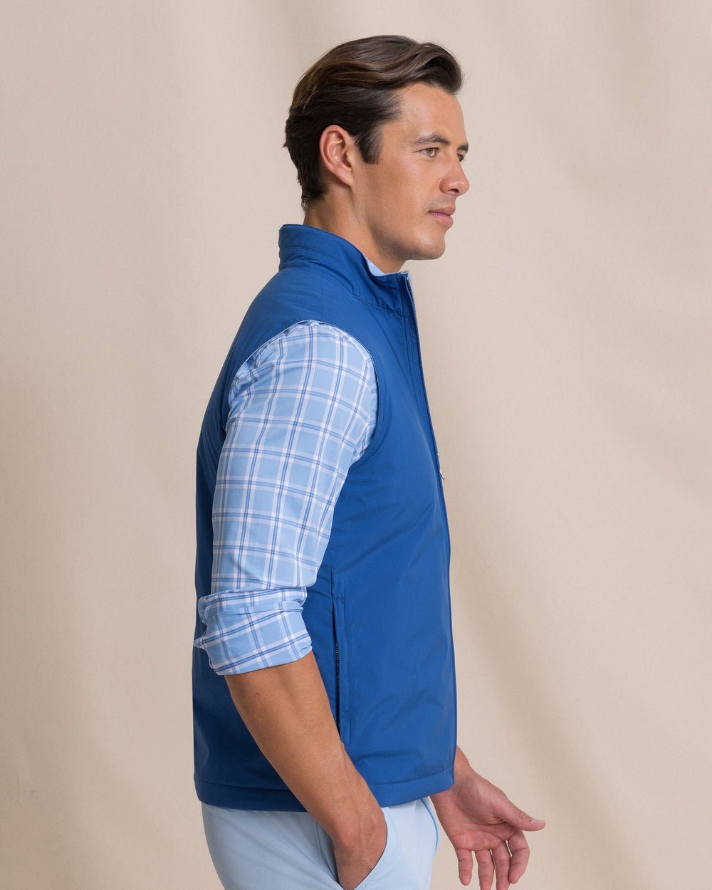 The side view of the Southern Tide Harbor Reversible Vest by Southern Tide - Nautical Blue