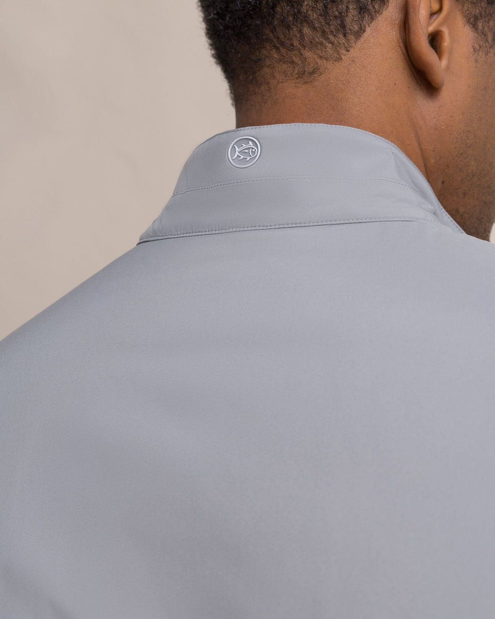 The detail view of the Southern Tide Harbor Reversible Vest by Southern Tide - Steel