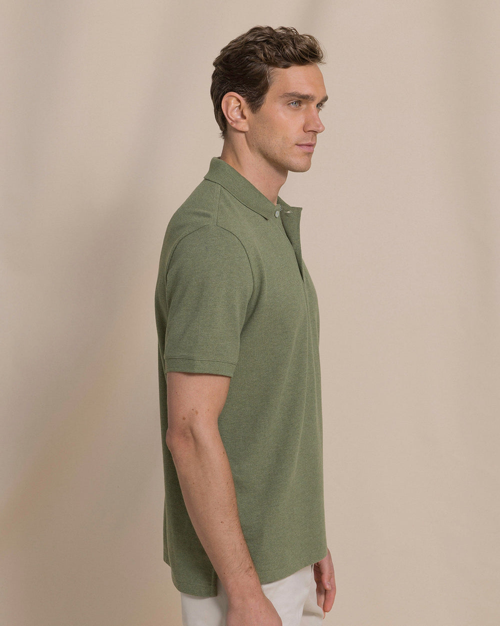 The side view of the Southern Tide Heather Skipjack Polo by Southern Tide - Heather Cedar Green