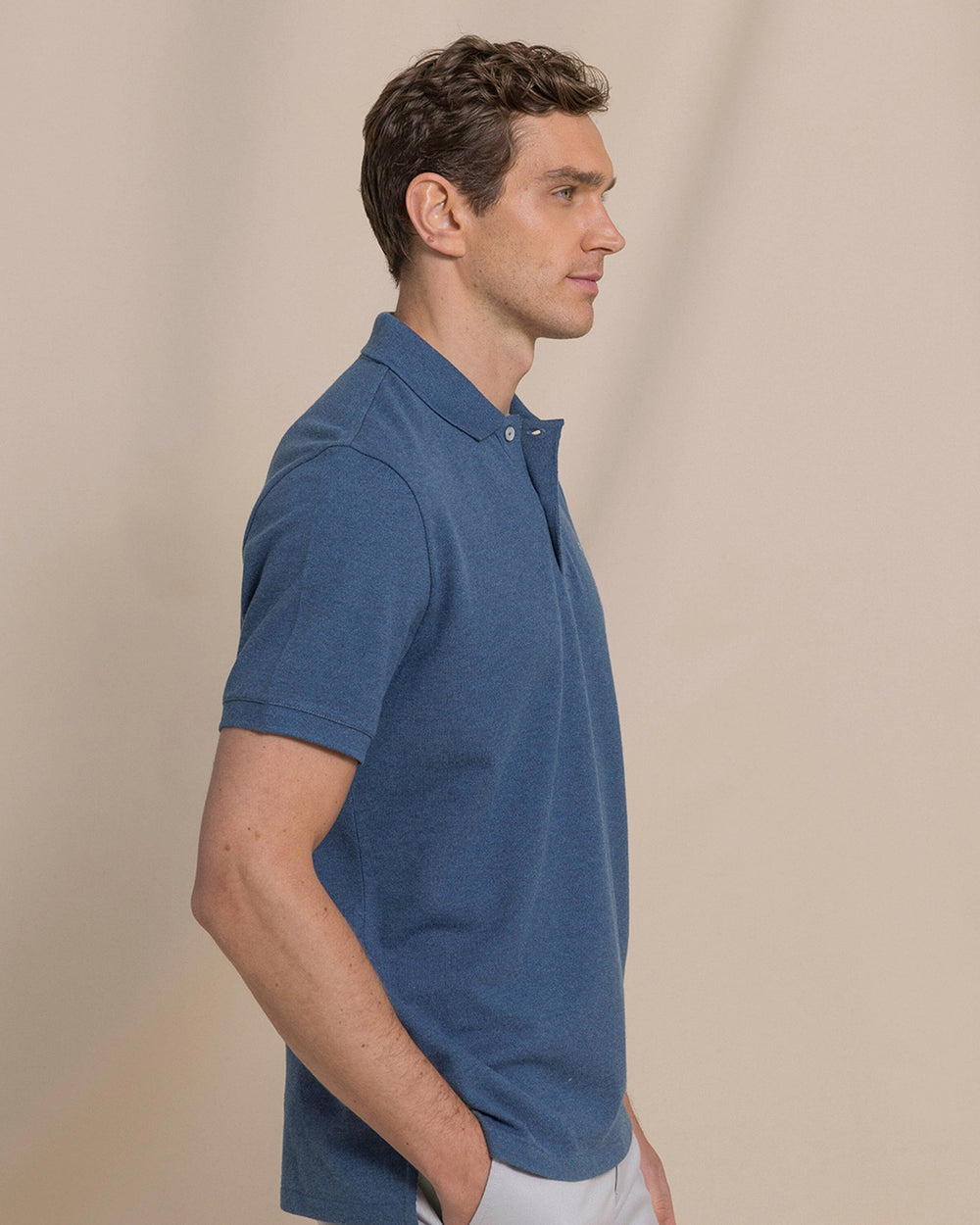 The side view of the Southern Tide Heather Skipjack Polo by Southern Tide - Heather Nautical Blue