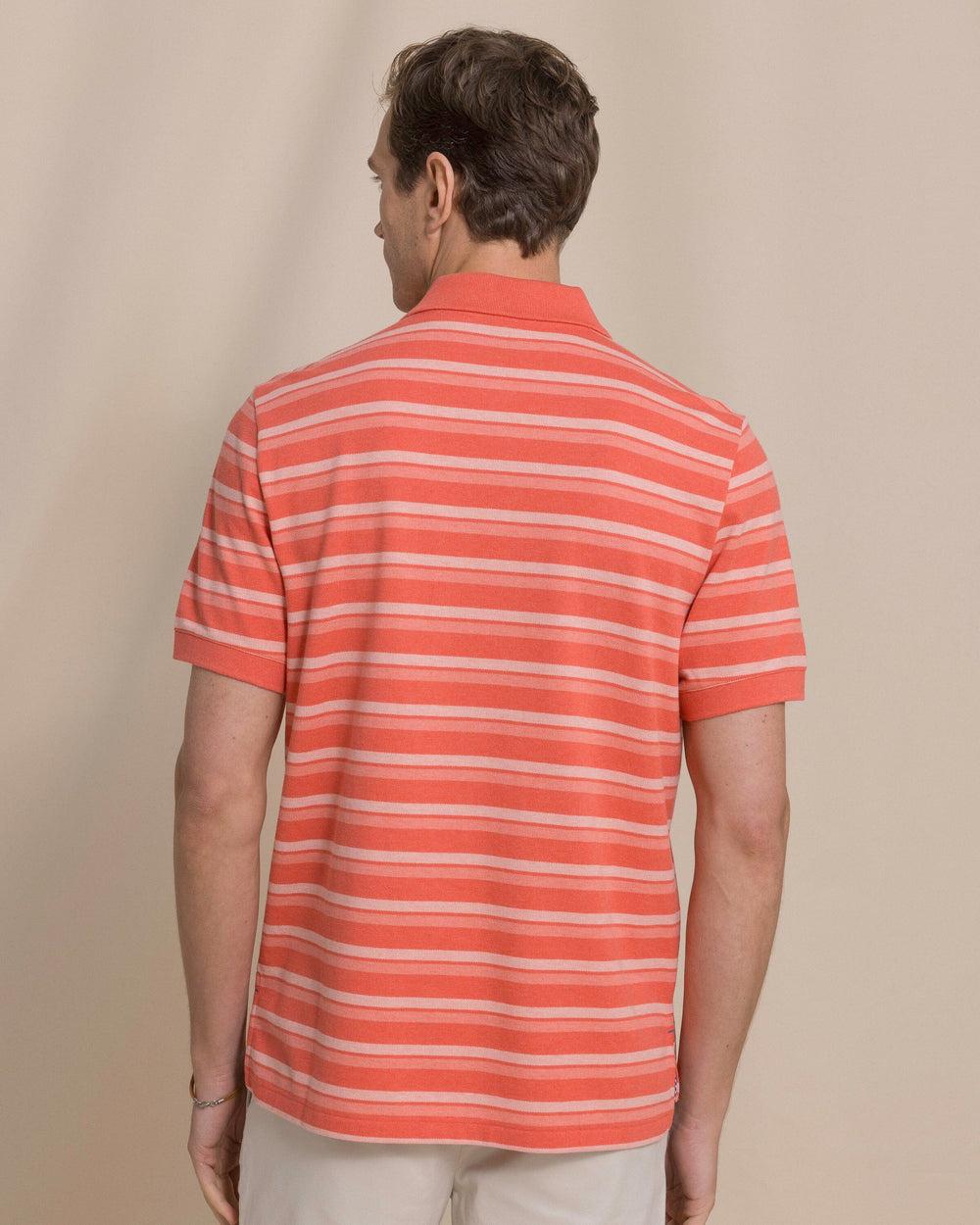 The back view of the Southern Tide Heather Striped Skipjack Polo by Southern Tide - Heather Coral Beach