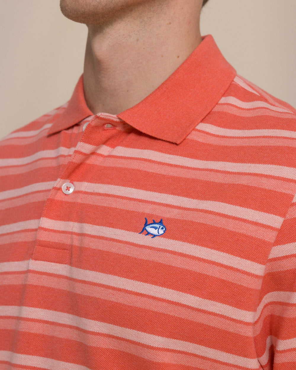The detail view of the Southern Tide Heather Striped Skipjack Polo by Southern Tide - Heather Coral Beach
