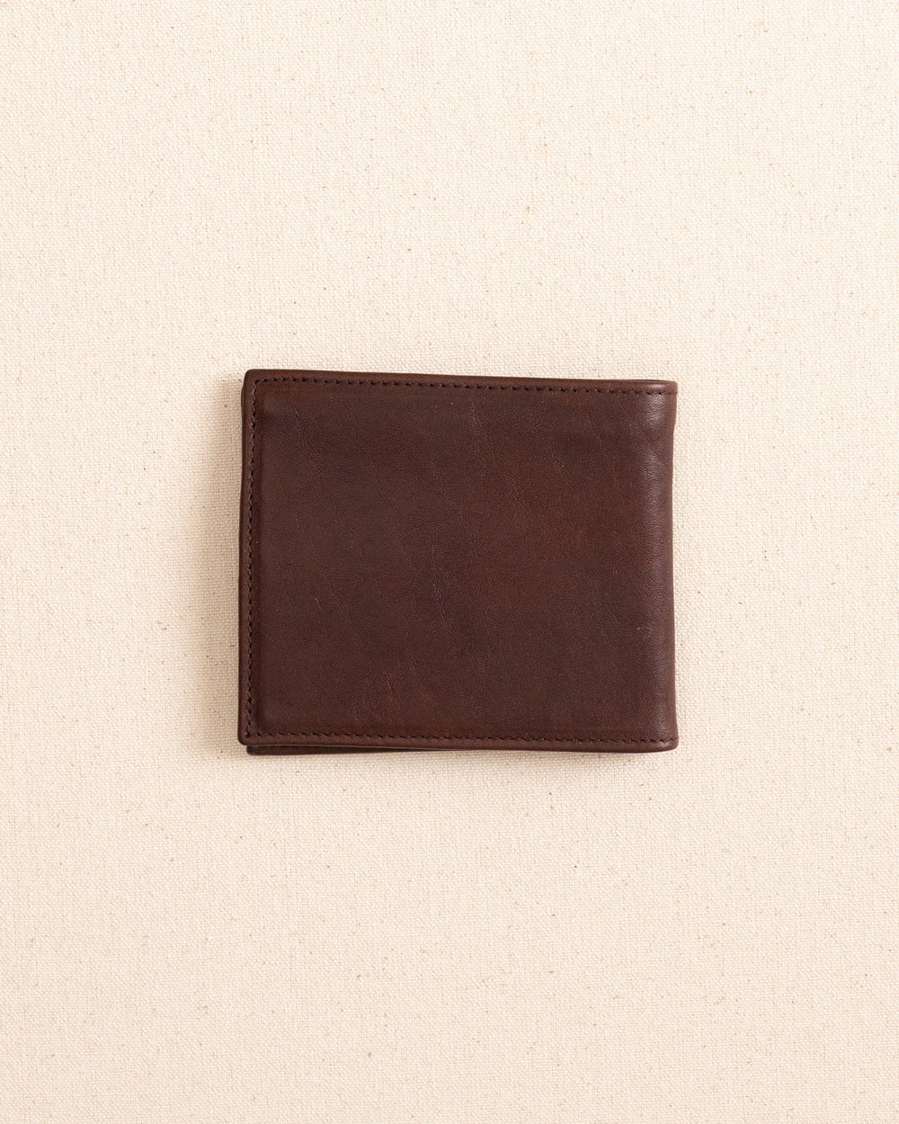 The back view of the Il Bisonte Classic Bifold Wallet at Southern Tide - Coffee