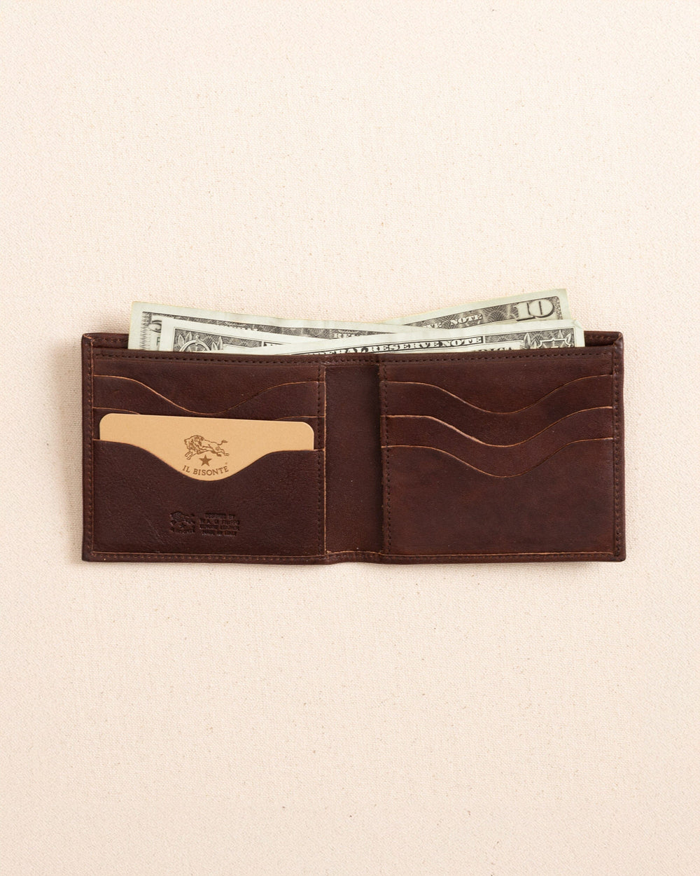 The open view of the Il Bisonte Classic Bifold Wallet at Southern Tide - Coffee
