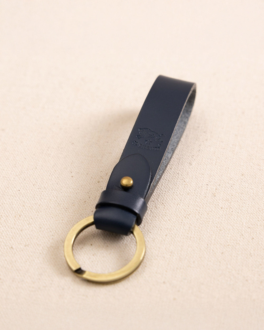 The detail view of the Il Bisonte Classic Key Fob at Southern Tide - Blue
