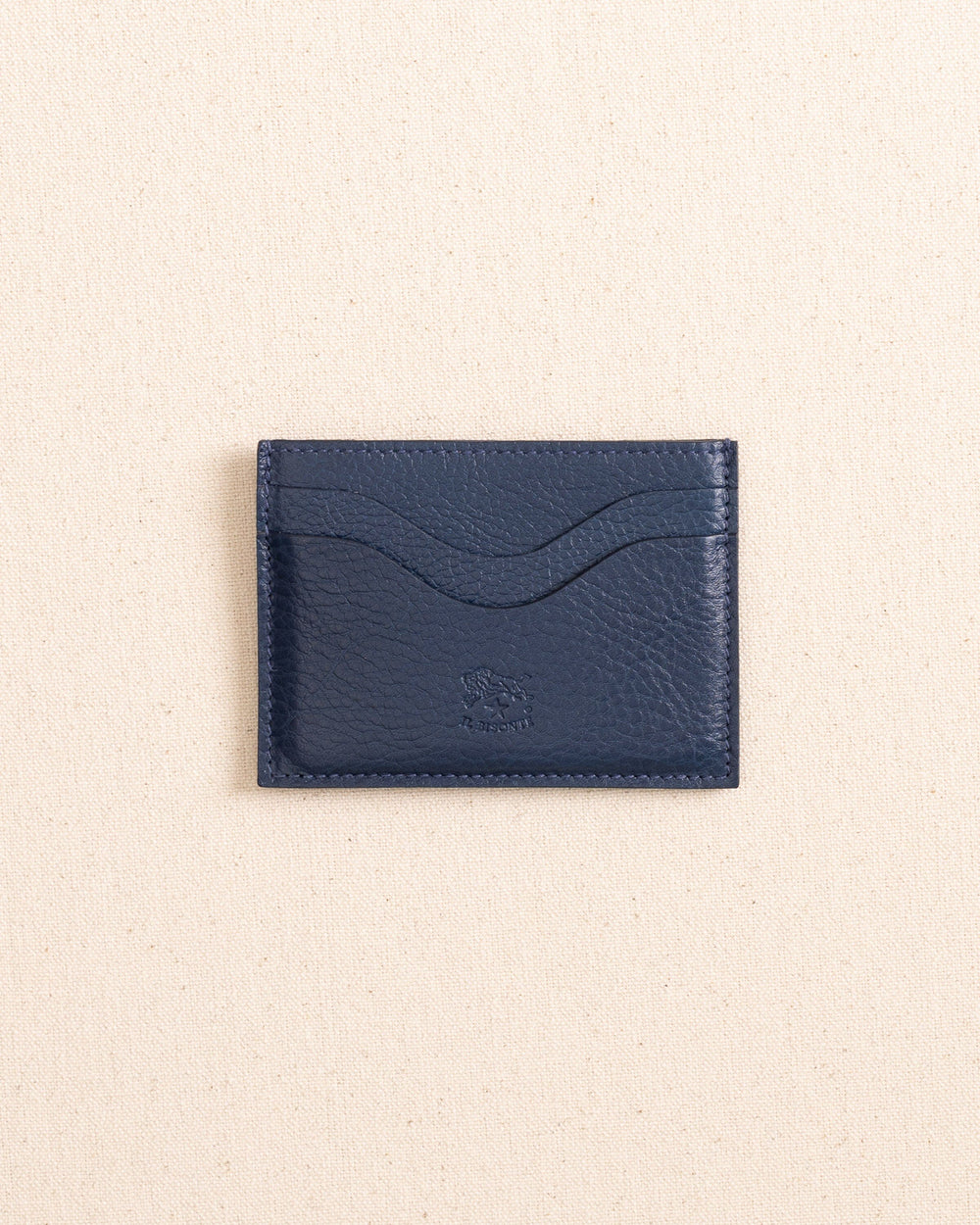 The front view of the Il Bisonte Salina Card Case at Southern Tide - Blue