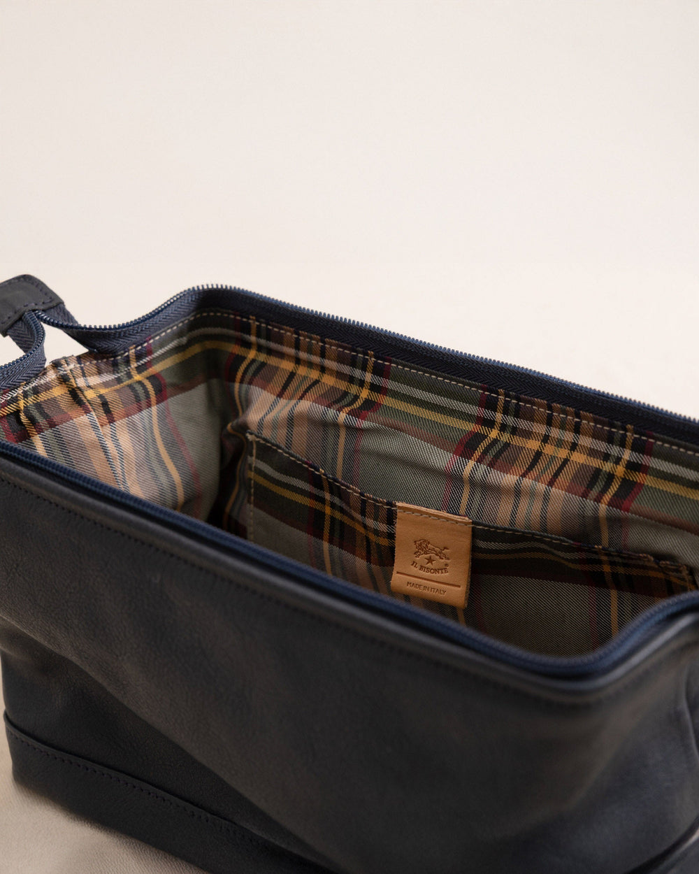 The detail view of the Il Bisonte Travel Bag at Southern Tide - Blue Mezzanotte
