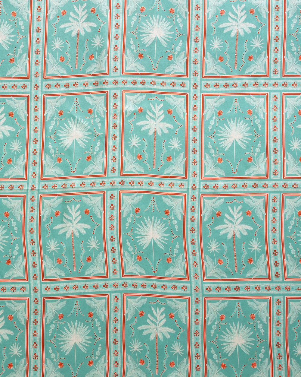 The detail view of the Southern Tide Swells Illustrated Palms Scarf by Southern Tide - Teal