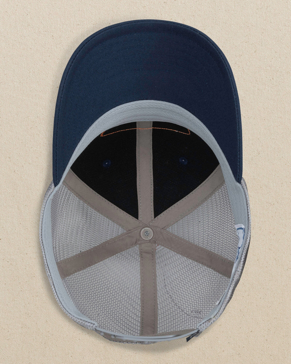 The under view of the Southern Tide Kids Vintage Badge Trucker Hat by Southern Tide - Navy