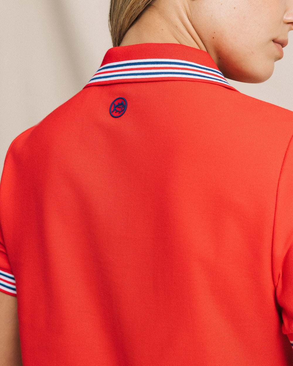 The detail view of the Southern Tide Laura Boxy Polo Shirt by Southern Tide - Channel Marker Red