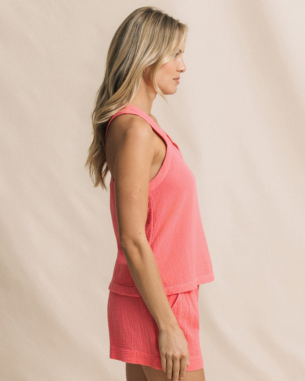 The side view of the Southern Tide Leila Double Cloth Garment Dye Solid Tank by Southern Tide - Island Pink