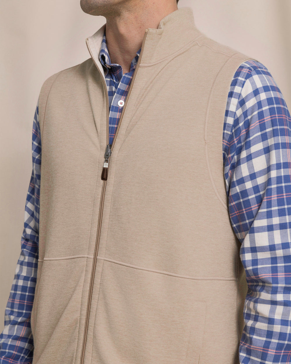 The detail view of the Southern Tide Lightweight Knit Heather Reversible Vest by Southern Tide - Heather Sandstone Khaki