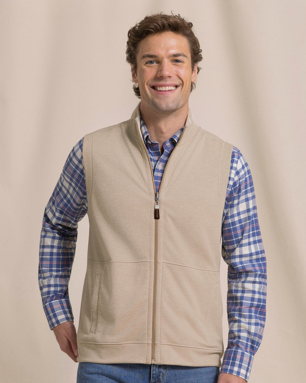 The front view of the Southern Tide Lightweight Knit Heather Reversible Vest by Southern Tide - Heather Sandstone Khaki
